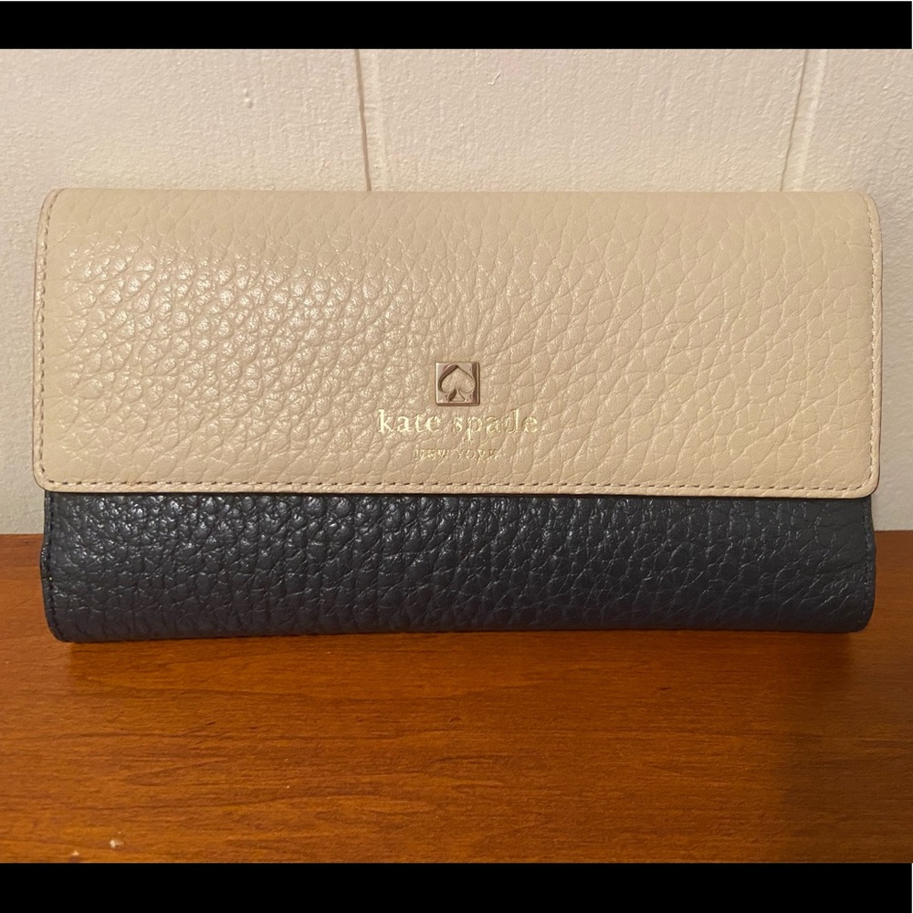 Very gently used Kate Spade tri-fold wallet.
